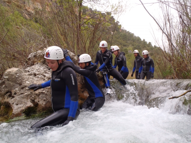  Group of people doing canyoning 